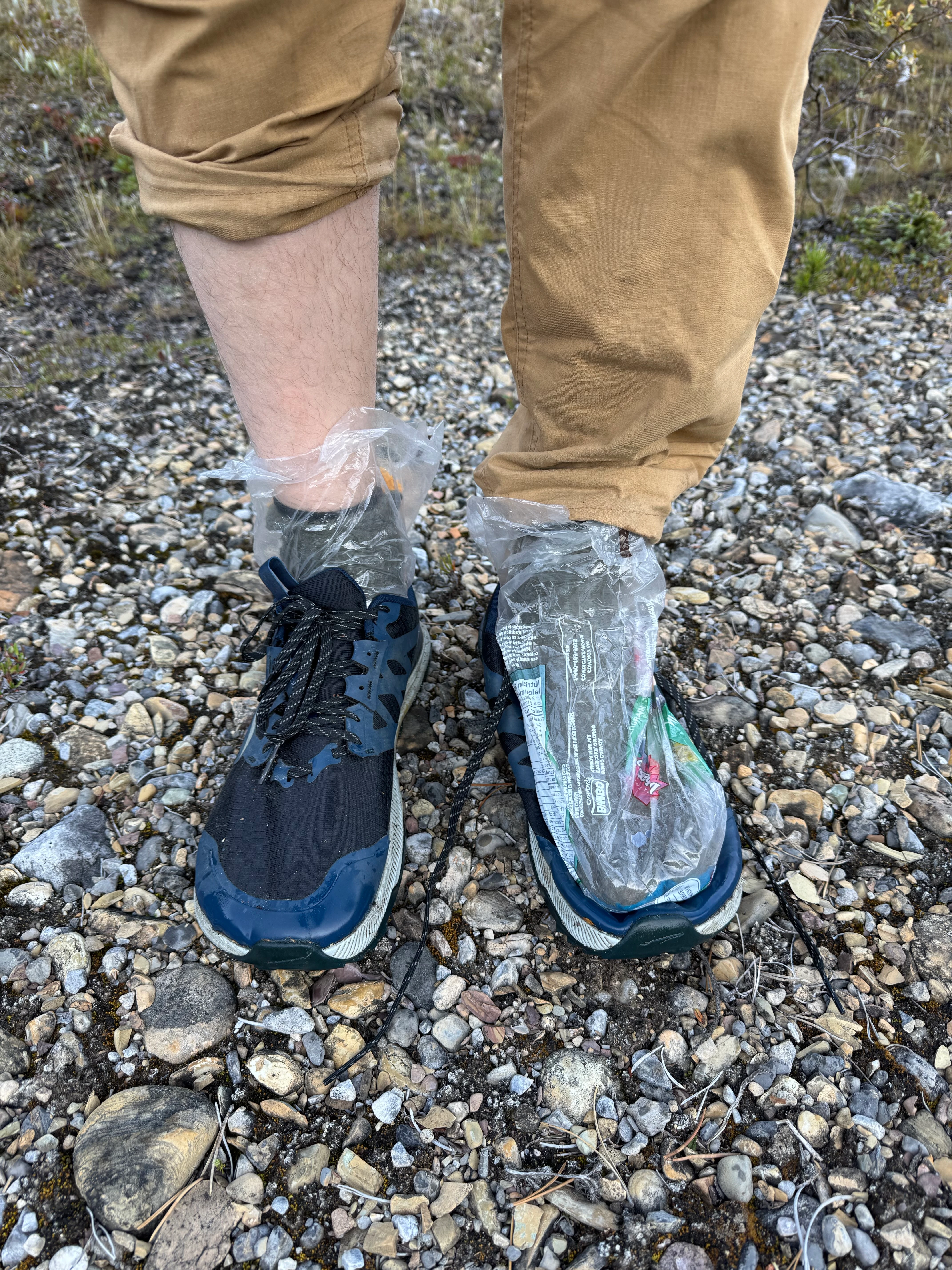 Trail running shoes with bread bags over socks